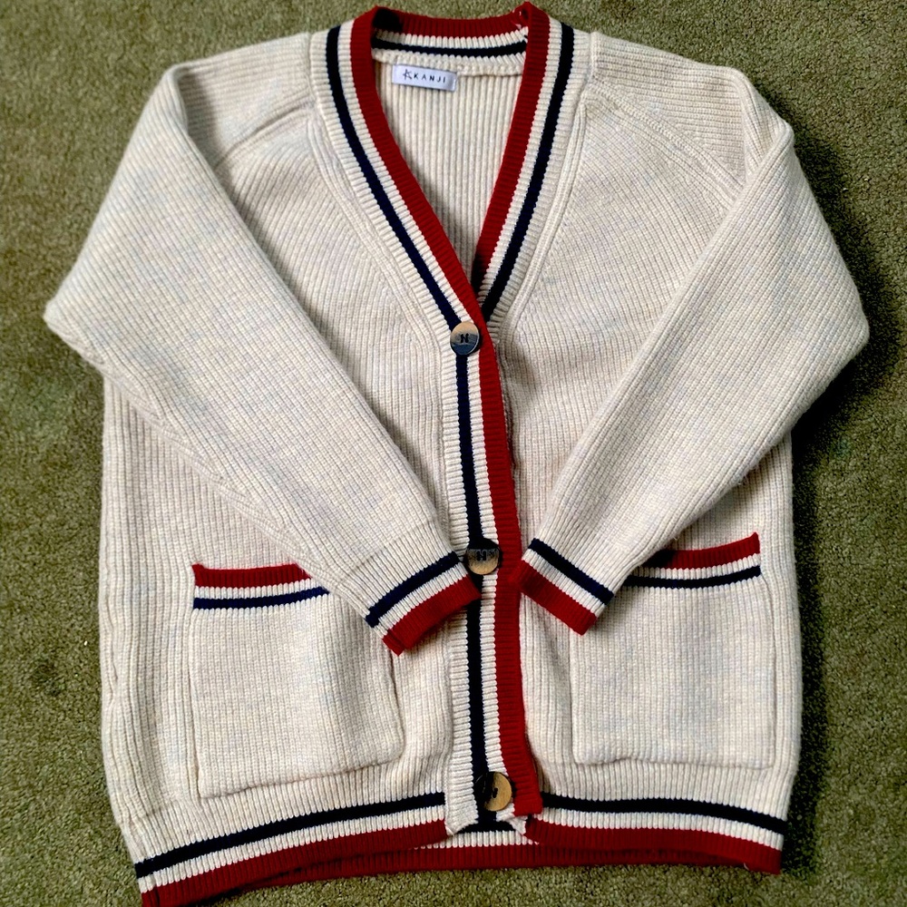Classic White Cardigan with Red and Blue Accents
